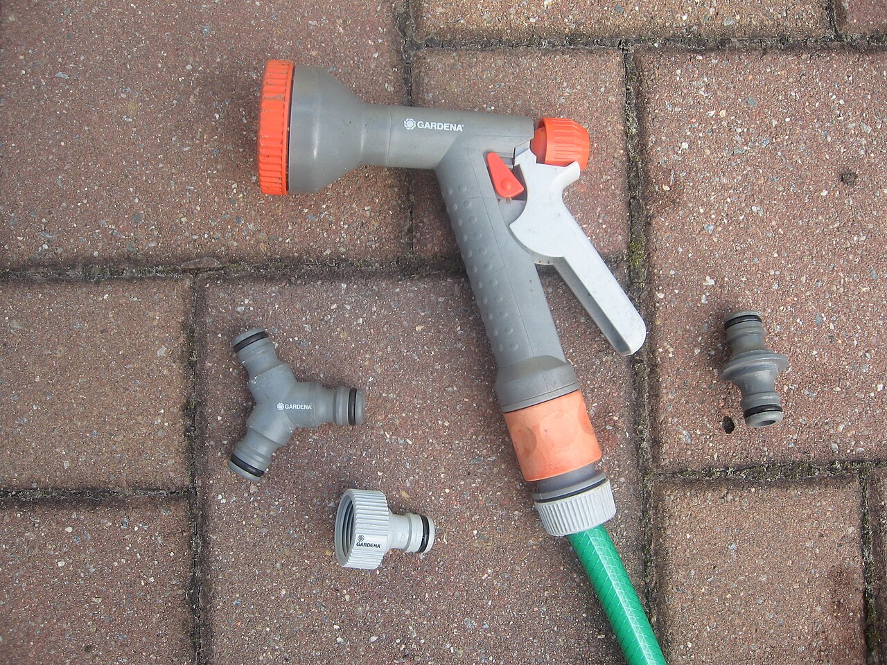 Garden sprinkler and various adapters for the Gardena plug system